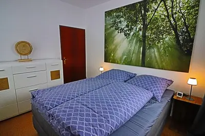 Ein Bett oder Betten in einem Zimmer der Unterkunft Lichtblick Hahnenklee - Happy Harz