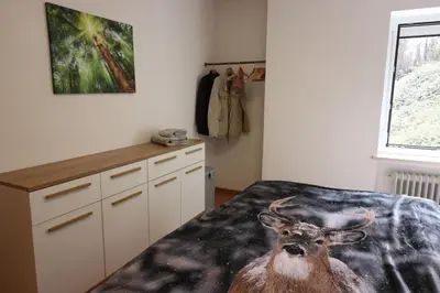 Ein Bett oder Betten in einem Zimmer der Unterkunft FeWo Happy Harz