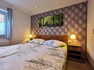 Ein Bett oder Betten in einem Zimmer der Unterkunft DAS Ferienhaus Waldblick