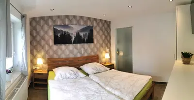 Ein Bett oder Betten in einem Zimmer der Unterkunft DAS Ferienhaus Waldblick