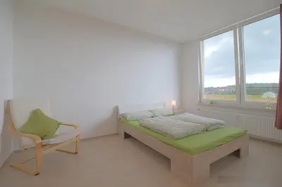 Ein Bett oder Betten in einem Zimmer der Unterkunft Penthouse 373