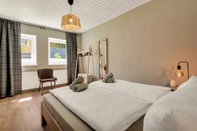 Ein Bett oder Betten in einem Zimmer der Unterkunft HIRSCH Hänsel Ferienhaus Garten mit Bergblick - Grill -Wald