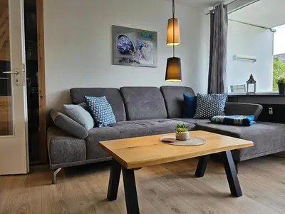 Ein Sitzbereich in der Unterkunft Familienwohnung Grünwald