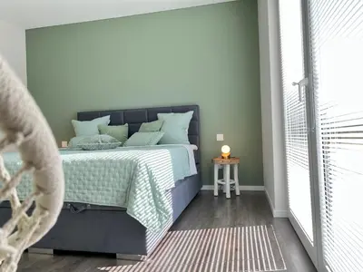 Ein Bett oder Betten in einem Zimmer der Unterkunft Zauberhafte Ferienwohnung mit Wellness-Bad