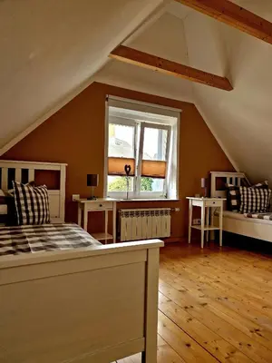 Ein Bett oder Betten in einem Zimmer der Unterkunft Ferienhaus Am Brunnen