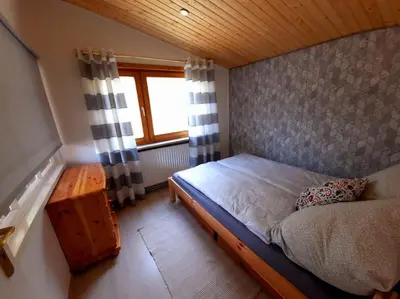 Ein Bett oder Betten in einem Zimmer der Unterkunft Romantischer Bungalow mit schönem Ausblick