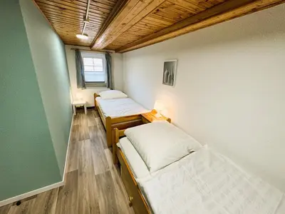 Ein Bett oder Betten in einem Zimmer der Unterkunft FeWo Dana im Haus HarzGlück