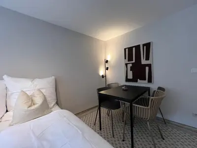 Ein Bett oder Betten in einem Zimmer der Unterkunft gina stay - Apartmenthaus im Zentrum von Quedlinburg