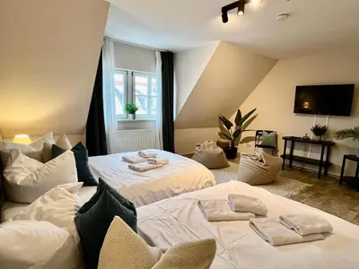 Ein Bett oder Betten in einem Zimmer der Unterkunft gina stay - Apartmenthaus im Zentrum von Quedlinburg