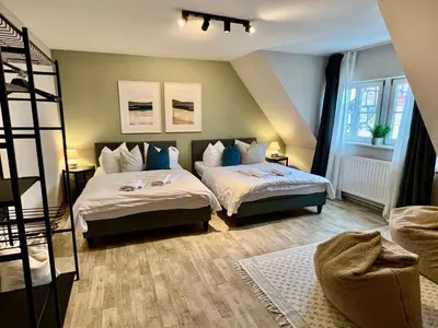 Ein Bett oder Betten in einem Zimmer der Unterkunft gina stay - Apartmenthaus im Zentrum von Quedlinburg