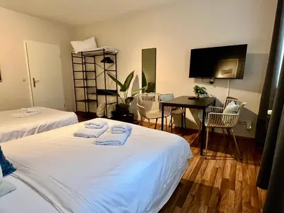 Ein Bett oder Betten in einem Zimmer der Unterkunft gina stay - Apartmenthaus im Zentrum von Quedlinburg