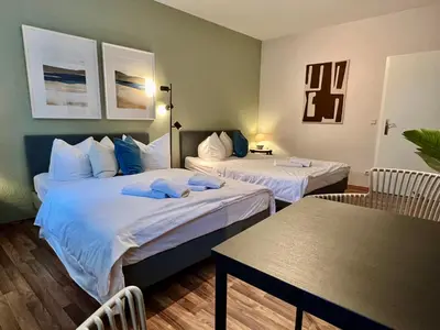 Ein Bett oder Betten in einem Zimmer der Unterkunft gina stay - Apartmenthaus im Zentrum von Quedlinburg