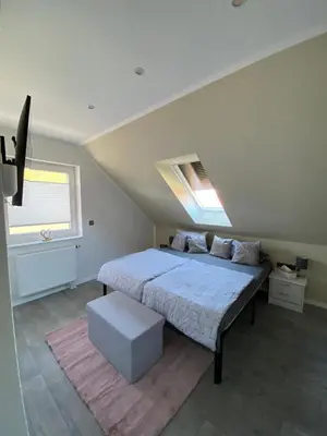 Ein Bett oder Betten in einem Zimmer der Unterkunft Ferienwohnung Harztraum