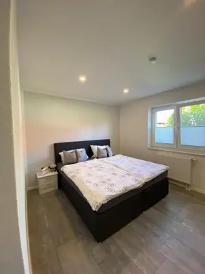 Ein Bett oder Betten in einem Zimmer der Unterkunft Ferienwohnung Harztraum