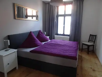Ein Bett oder Betten in einem Zimmer der Unterkunft Kaufmannshaus Anno 1613