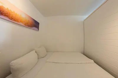 Ein Bett oder Betten in einem Zimmer der Unterkunft Apartment 454