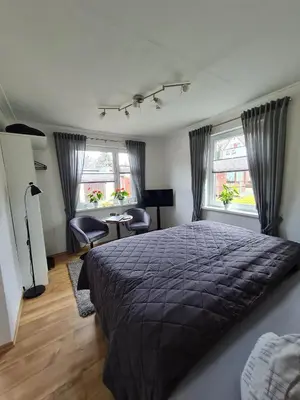 Ein Bett oder Betten in einem Zimmer der Unterkunft Harz-Stübchen