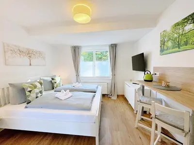 Ein Bett oder Betten in einem Zimmer der Unterkunft REGIOHOTEL Harzresidenz Wernigerode - #Familienfreundlich #FrischRenoviert #Waschmaschine #FreeParking