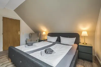 Ein Bett oder Betten in einem Zimmer der Unterkunft Hirsch-Apartment-5 Eulennest