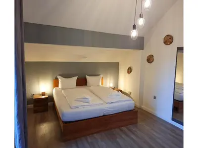 Ein Bett oder Betten in einem Zimmer der Unterkunft Ferienhaus im Kurort inkl Frühstück