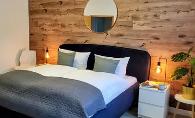 Ein Bett oder Betten in einem Zimmer der Unterkunft HIRSCH FeWo Brocken - Parkplatz - Zentral