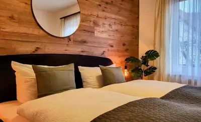 Ein Bett oder Betten in einem Zimmer der Unterkunft HIRSCH FeWo Brocken - Parkplatz - Zentral