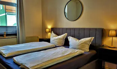 Ein Bett oder Betten in einem Zimmer der Unterkunft HIRSCH Apartment Waldhörnchen - zentral - ruhig
