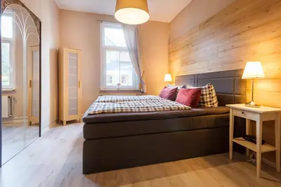 Ein Bett oder Betten in einem Zimmer der Unterkunft HIRSCH Apartment Gartenschläfer - zentral - Garten