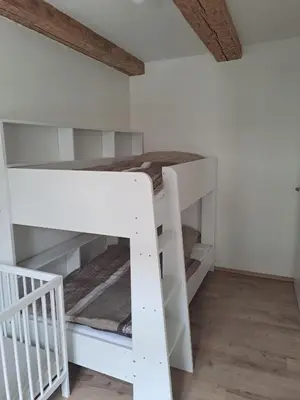 Ein Bett oder Betten in einem Zimmer der Unterkunft Ferienwohnung Erna