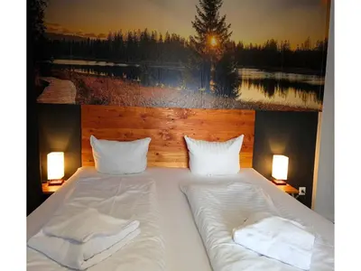 Ein Bett oder Betten in einem Zimmer der Unterkunft Ferienhaus im Kurort inkl Frühstück
