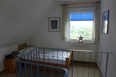 Ein Bett oder Betten in einem Zimmer der Unterkunft Ferienwohnung Parkresidenz