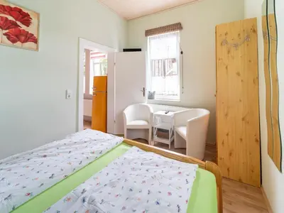 Ein Bett oder Betten in einem Zimmer der Unterkunft Quiet Garden Apartment