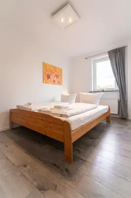 Ein Bett oder Betten in einem Zimmer der Unterkunft Ferienhaus Nia