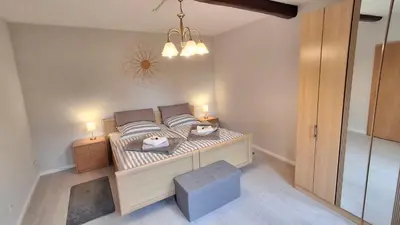 Ein Bett oder Betten in einem Zimmer der Unterkunft Zum Winzer