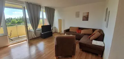 Ein Sitzbereich in der Unterkunft Cozy Apartment in Harz
