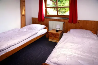 Ein Bett oder Betten in einem Zimmer der Unterkunft Ferienwohnungen Forellengrund Schierke