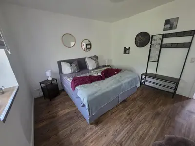 Ein Bett oder Betten in einem Zimmer der Unterkunft Fewo zum Reiterhof