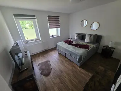 Ein Bett oder Betten in einem Zimmer der Unterkunft Fewo zum Reiterhof