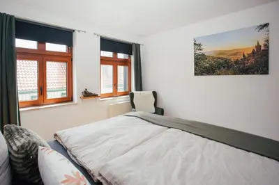 Ein Bett oder Betten in einem Zimmer der Unterkunft Exklusive Goethe-Suite am Brocken by Meis in Wernigerode Zentral