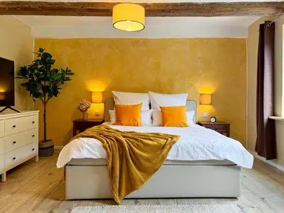 Ein Bett oder Betten in einem Zimmer der Unterkunft Haus Ludwig - Saniertes Fachwerkhaus im Harz - 12 Personen