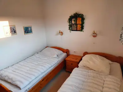 Ein Bett oder Betten in einem Zimmer der Unterkunft Apartment Mathilda mit Pool & Sauna