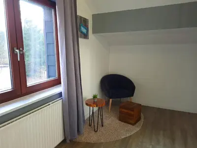 Ein Sitzbereich in der Unterkunft Ferienwohnung am Hotel 