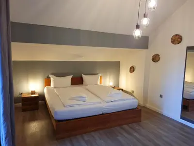 Ein Bett oder Betten in einem Zimmer der Unterkunft Ferienwohnung am Hotel 