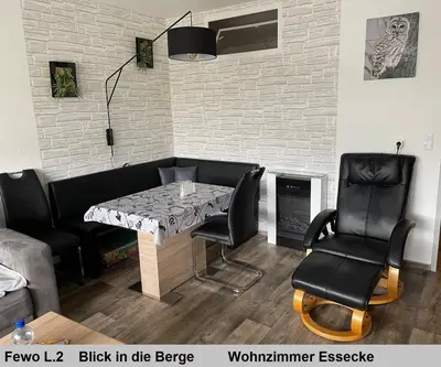 Ein Sitzbereich in der Unterkunft Harz Fewo Eulennestchen L2