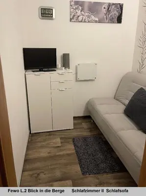 Ein Sitzbereich in der Unterkunft Harz Fewo Eulennestchen L2