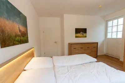 Ein Bett oder Betten in einem Zimmer der Unterkunft Ferienwohnung Hirschmann 2 mit Sauna und Balkon