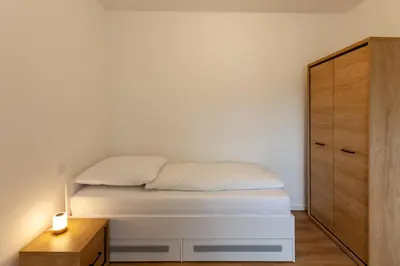 Ein Bett oder Betten in einem Zimmer der Unterkunft Ferienwohnung Hirschmann 4
