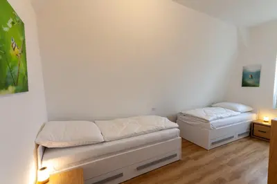 Ein Bett oder Betten in einem Zimmer der Unterkunft Ferienwohnung Hirschmann 5 mit Kamin