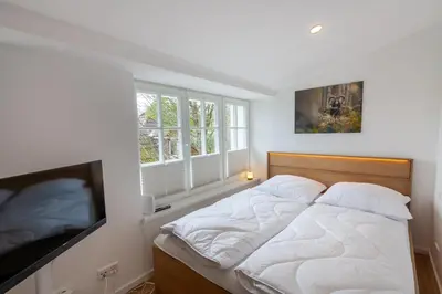 Ein Bett oder Betten in einem Zimmer der Unterkunft Ferienwohnung Hirschmann 6