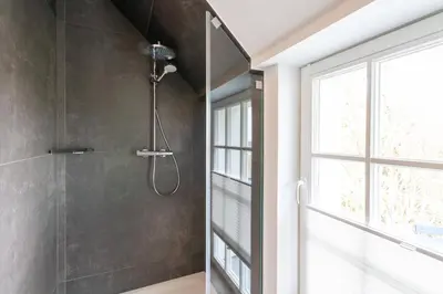Ein Badezimmer in der Unterkunft Ferienwohnung Hirschmann 7 mit Sauna, Kamin, Balkon
